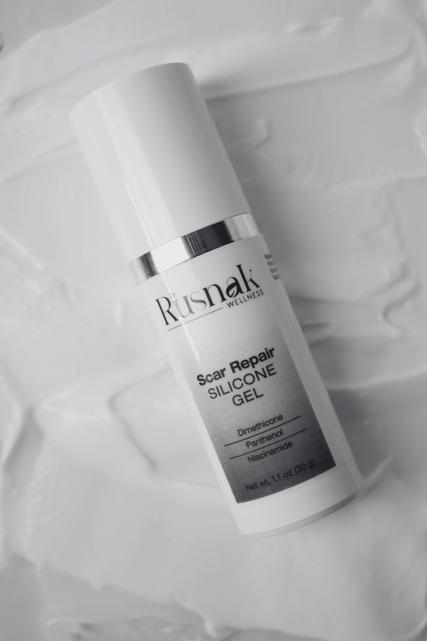 Dr Rusnak Wellness Scar Repair Silicone Gel bottle on a textured white background
